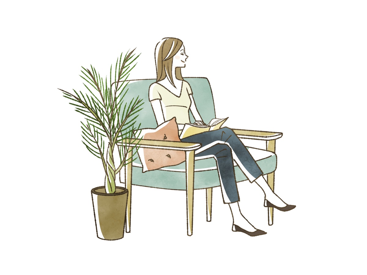 緑のソファで脚を組んで座り、本を読む女性のイラスト